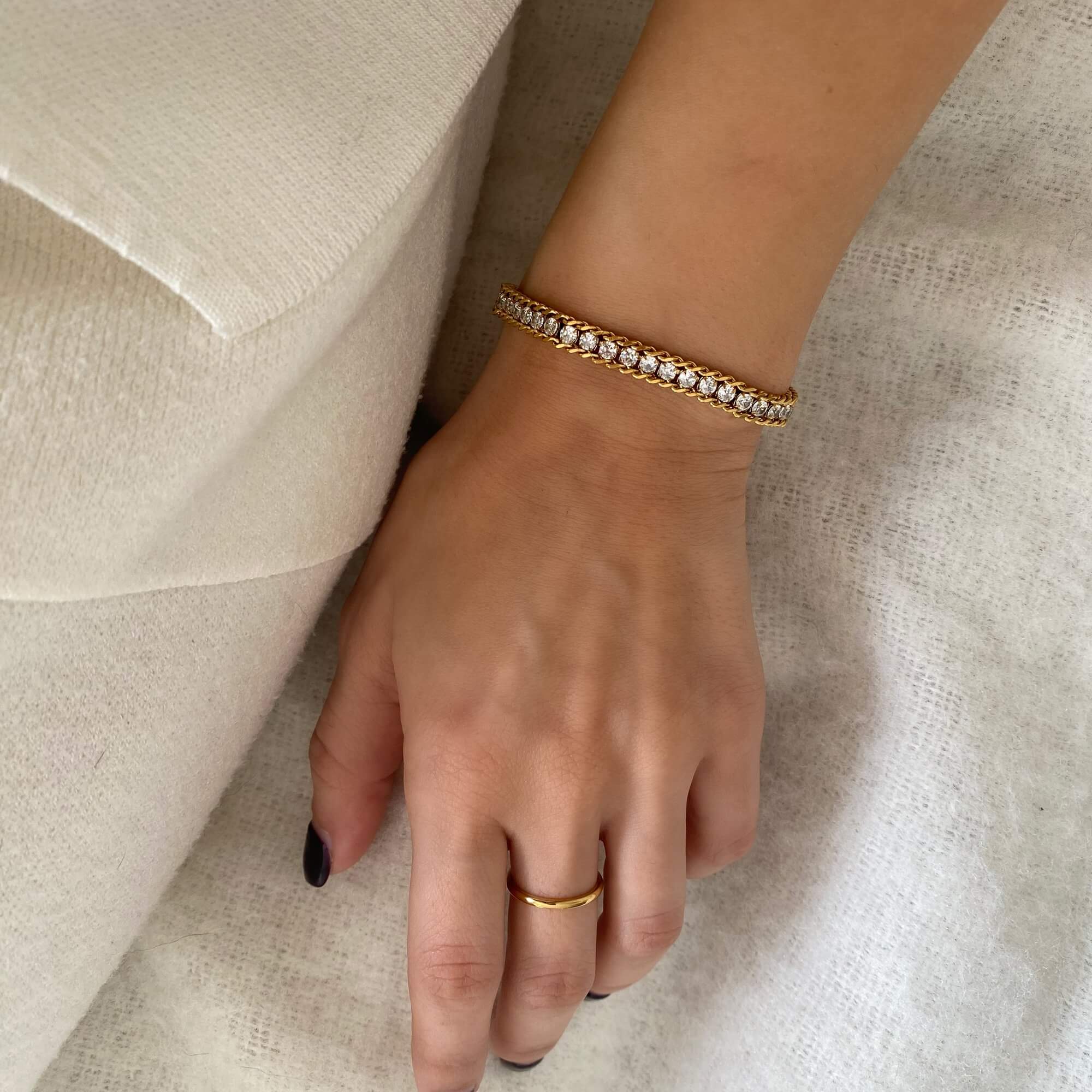 Top-down view of the KaperB tennis chain bracelet by Kampy Designs, showcasing its even stone setting and radiant symmetry.