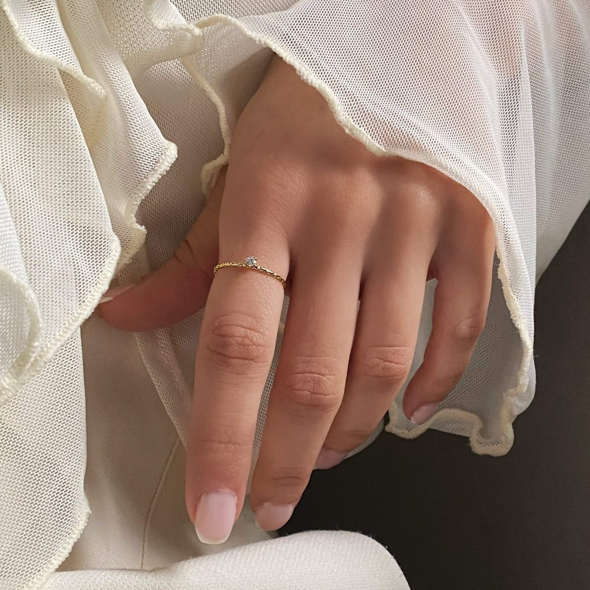 The KikoR thin diamond stacker ring by Kampy Designs, beautifully worn to showcase its refined and minimalist design with sparkling diamonds