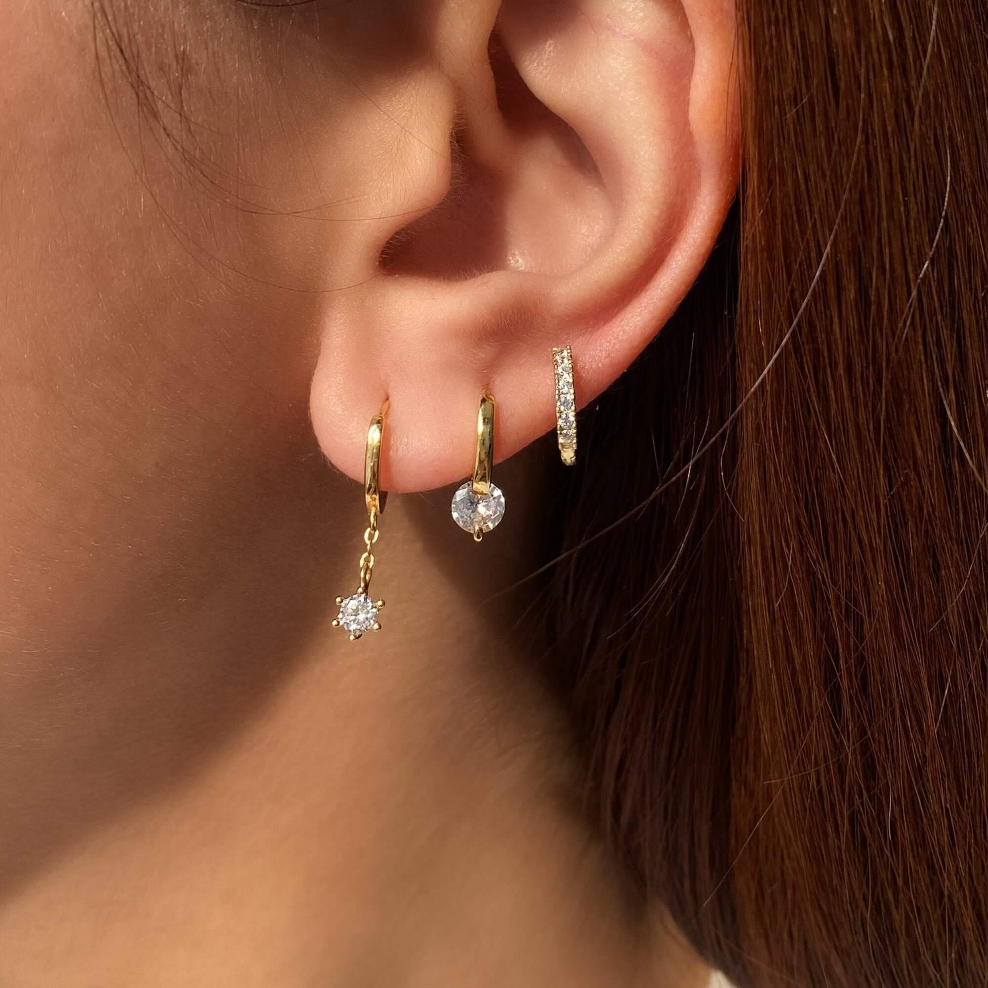 Alternative stacked view of the KwalaE tiny hoop drop diamond earrings by Kampy Designs, layered to create a bold and fashionable look.