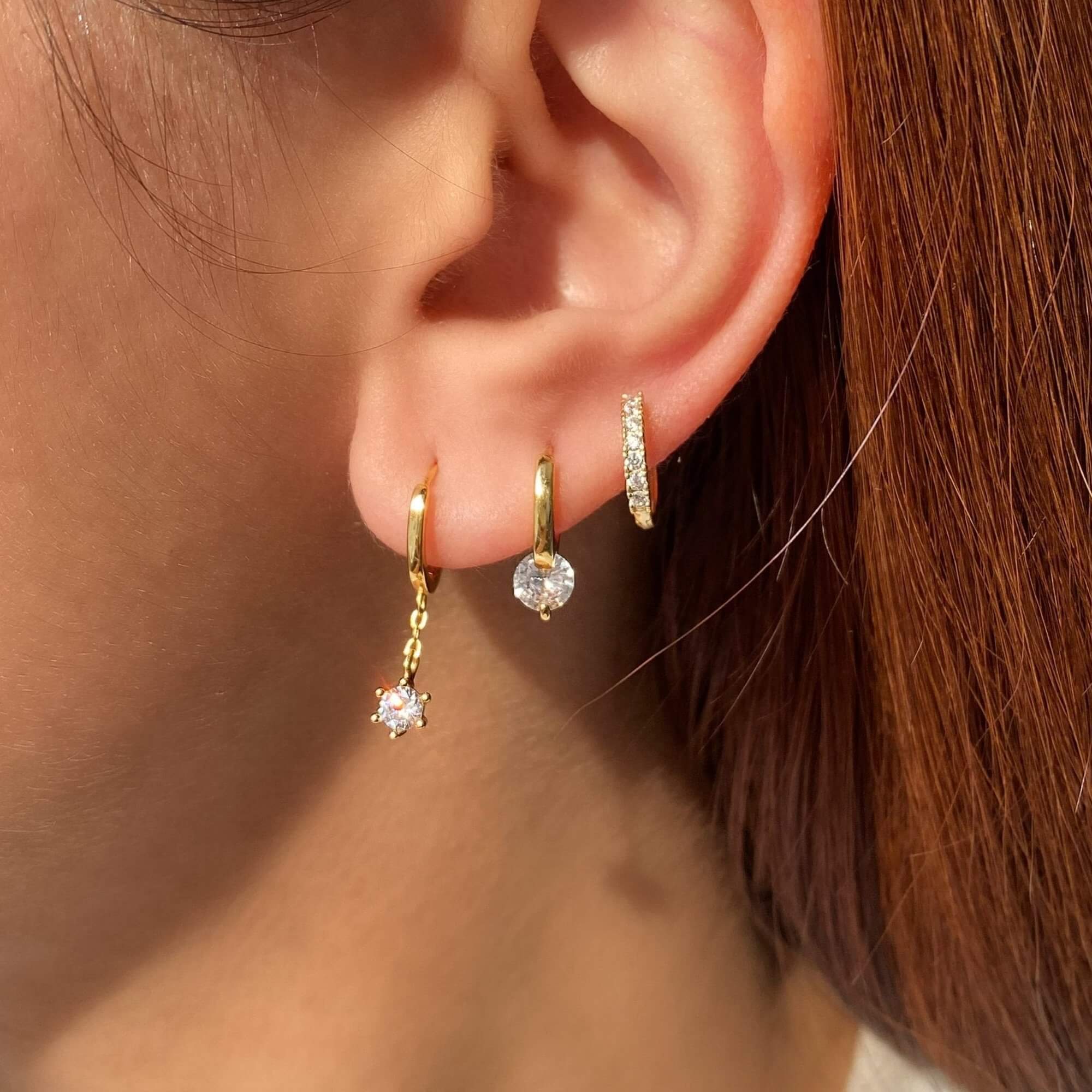 The KwalaE tiny hoop drop diamond earrings by Kampy Designs, styled to showcase their modern and minimalist elegance.