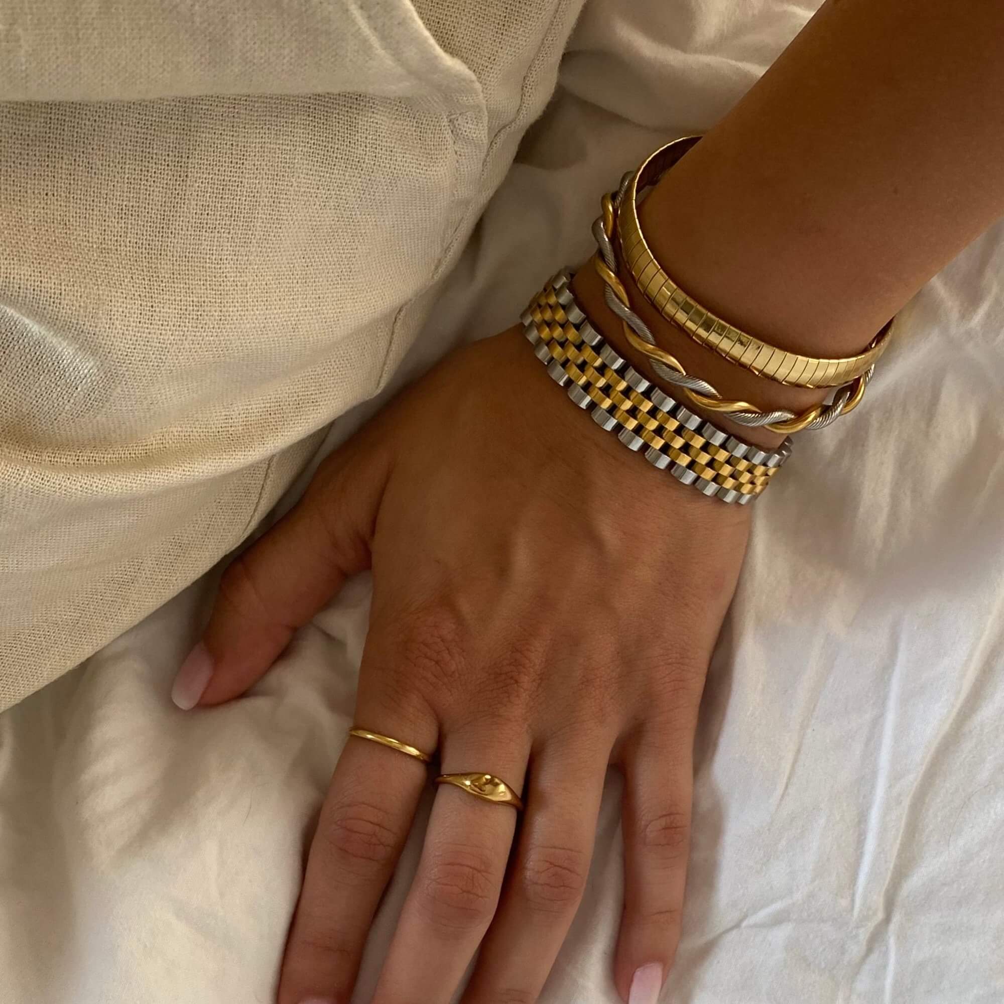 Top view of the KeranB two-toned thick watch bracelet (16.5cm-18cm) by Kampy Designs, displaying its polished gold and silver links with precision detailing.