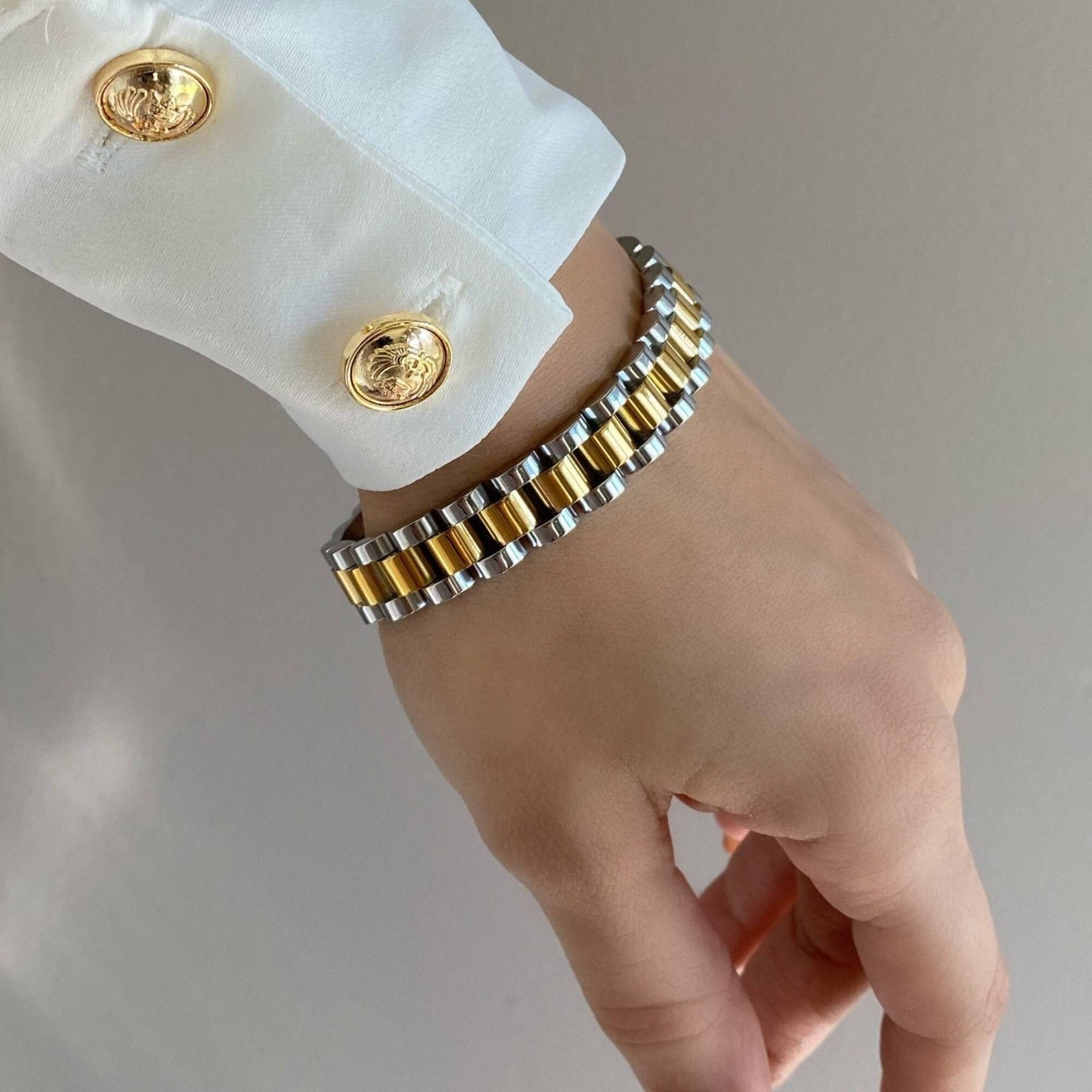 The KennedyB two-toned watch band bracelet by Kampy Designs, stylishly worn to showcase its elegant mixed-metal design and classic aesthetic.