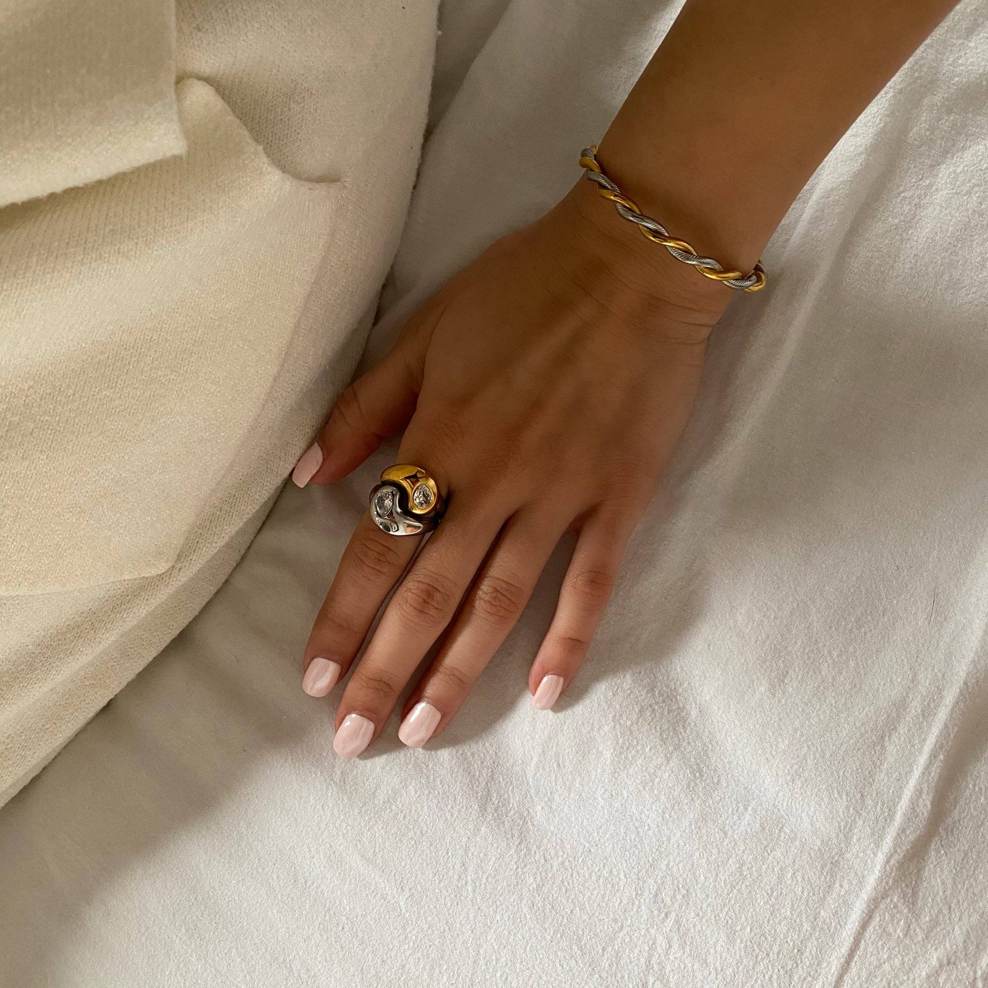 KangR two-toned yin yang ring by Kampy Designs, worn on model’s finger to showcase its bold contrast and symbolic harmony.
