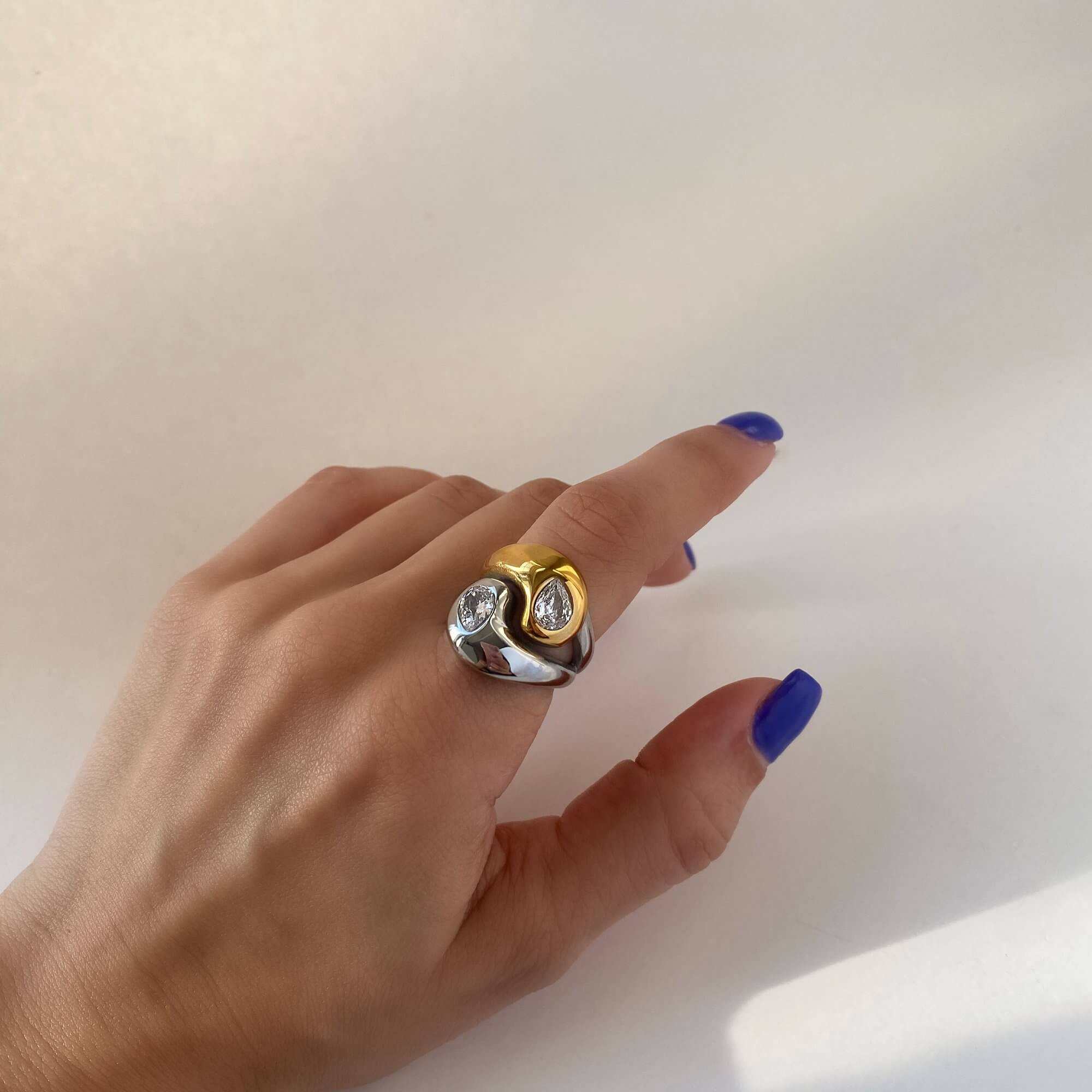The KangR two-toned yin yang ring by Kampy Designs, worn on the model’s hand to showcase its bold dual-color symbolism and polished finish.