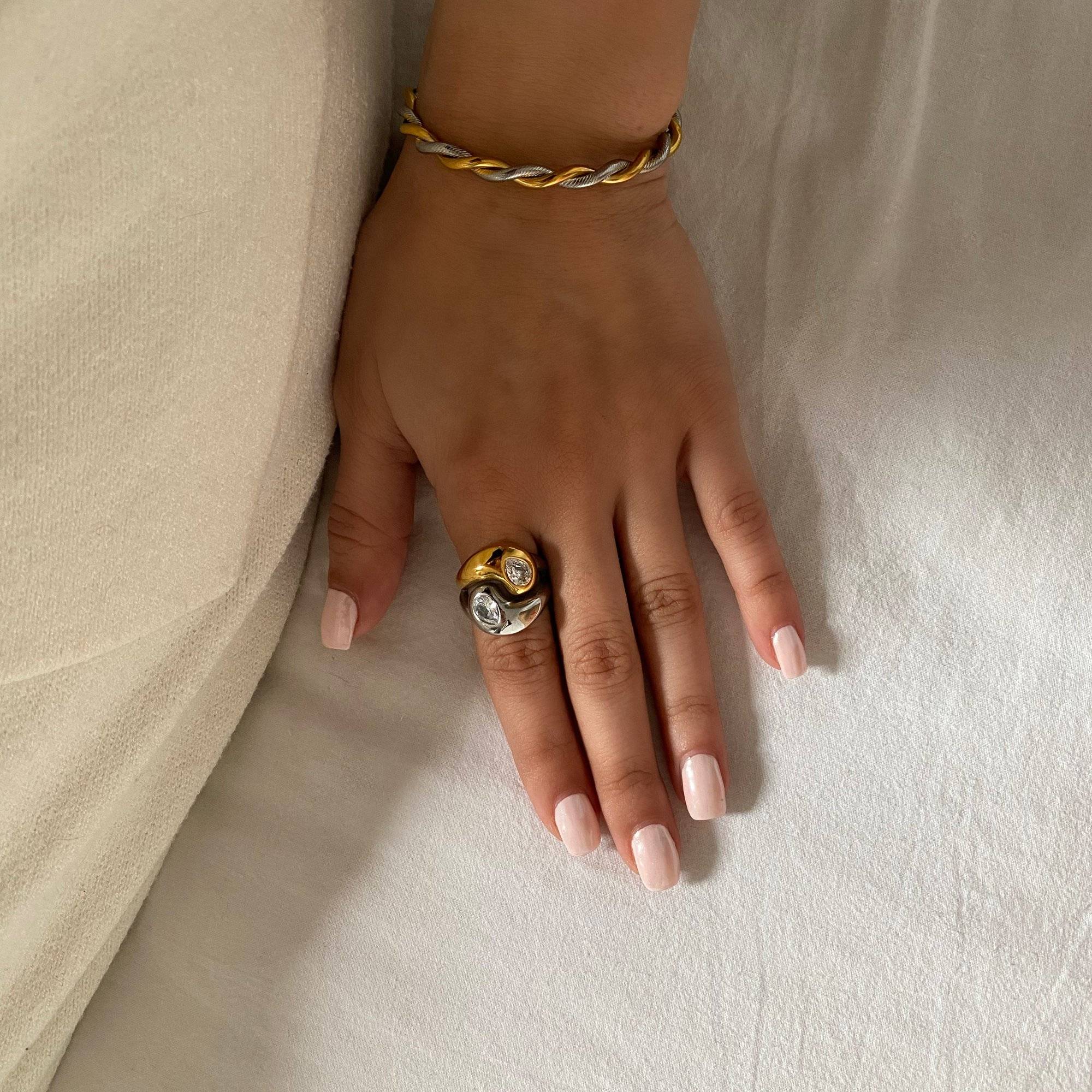 Full view of KangR two-toned yin yang ring by Kampy Designs, featuring a balanced black and white enamel design with sleek gold trim.