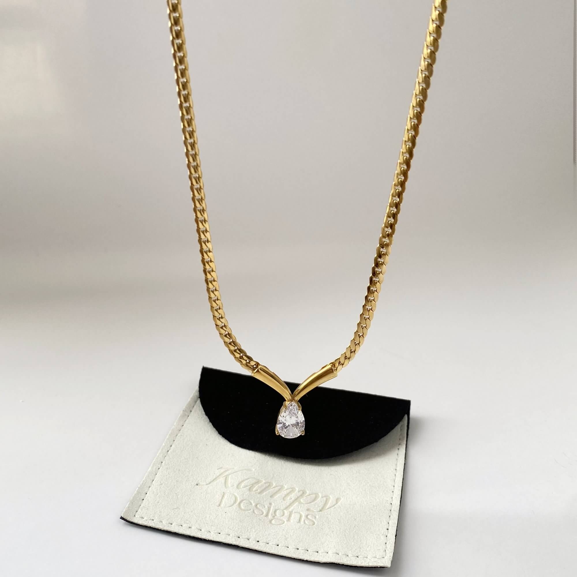 Front-facing view of the Kaliyan V-chain necklace with pear-shaped diamond by Kampy Designs, showcasing the pendant’s sparkle and elegant symmetry.
