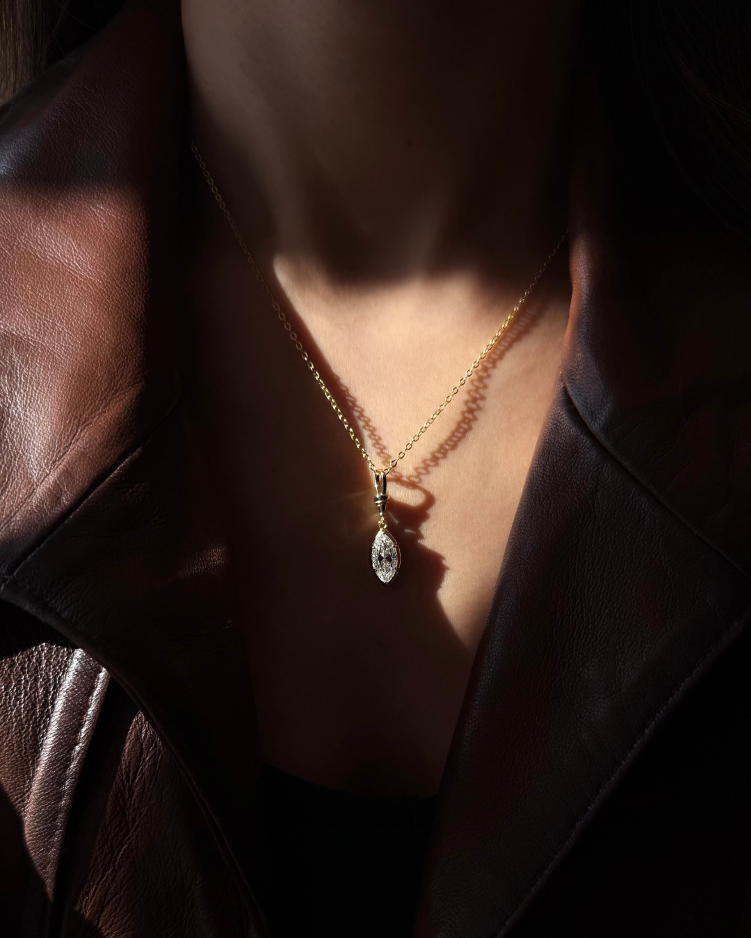 White moissanite marquise pendant necklace styled for everyday wear with minimalist gold chain by Kampy