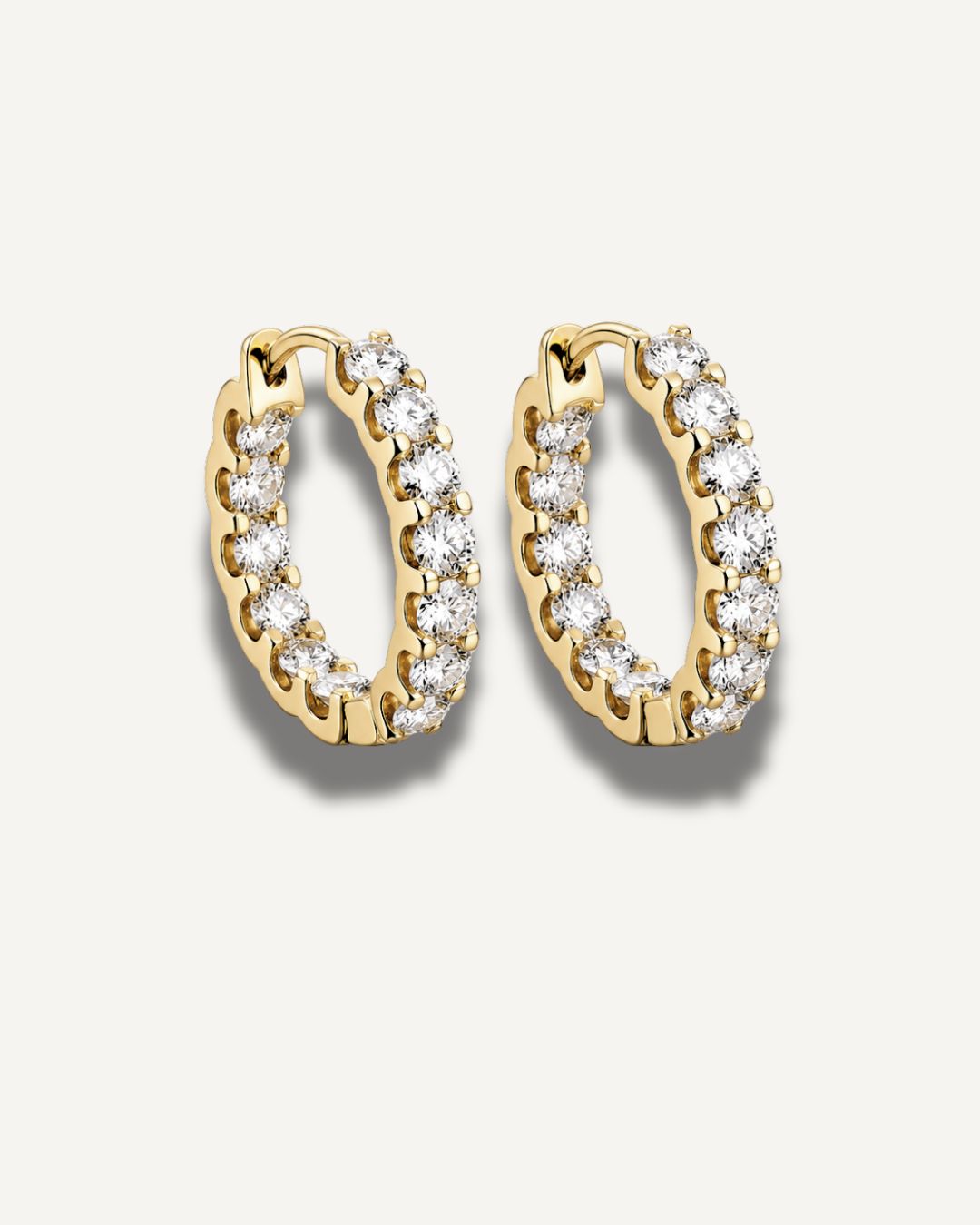 20 mm gold moissanite huggie hoop earrings made with 18k gold plating on 925 sterling silver by Kampy Designs.
