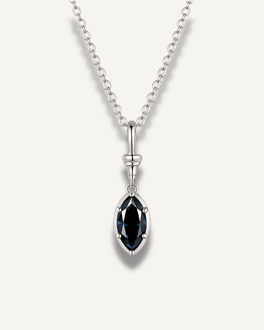 Marquise-cut midnight blue moissanite pendant necklace in white gold-plated 925 sterling silver on fine chain.