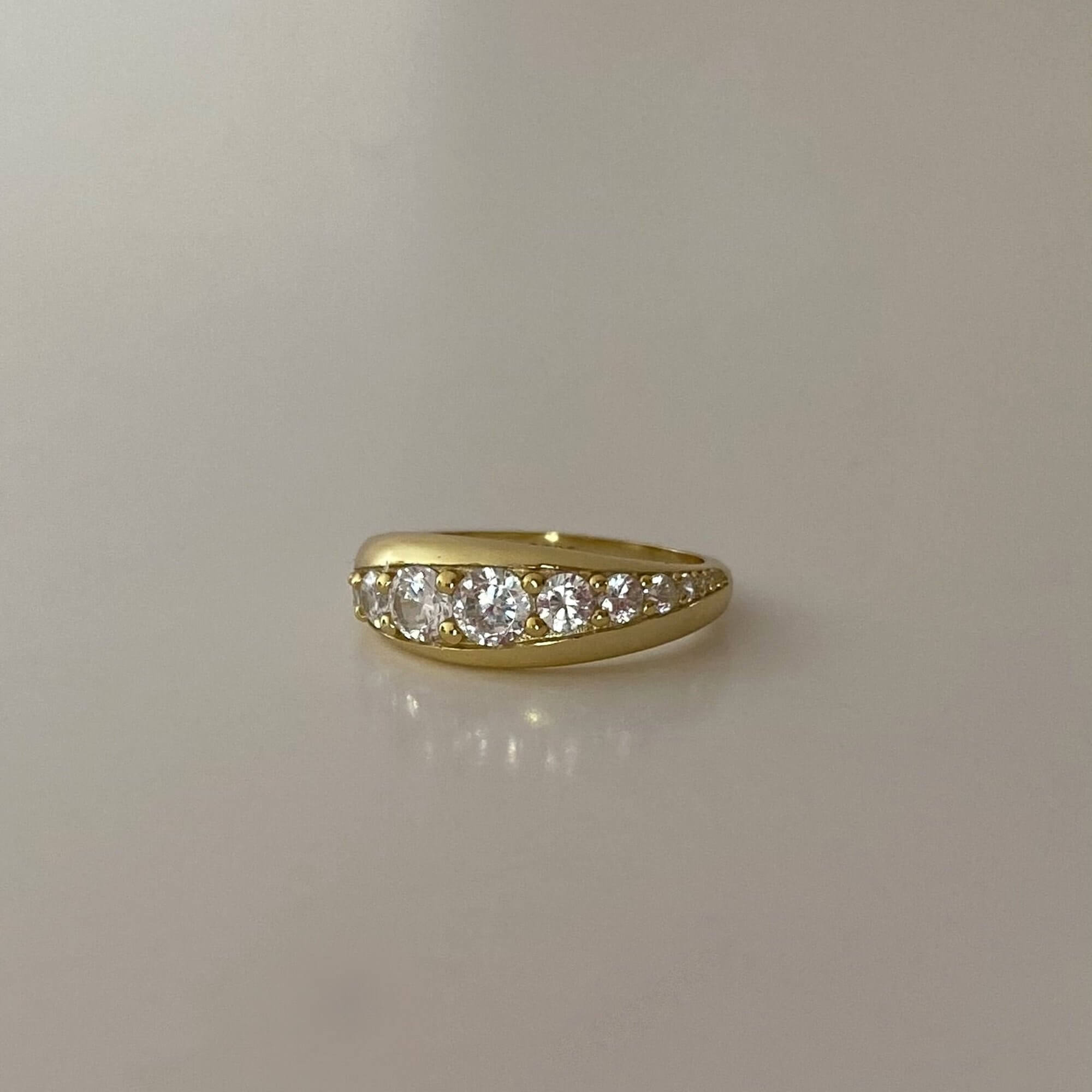 Angled view of the KandyR 14K gold-plated tapered diamond ring by Kampy Designs, highlighting its stunning diamond arrangement and sleek tapered band.