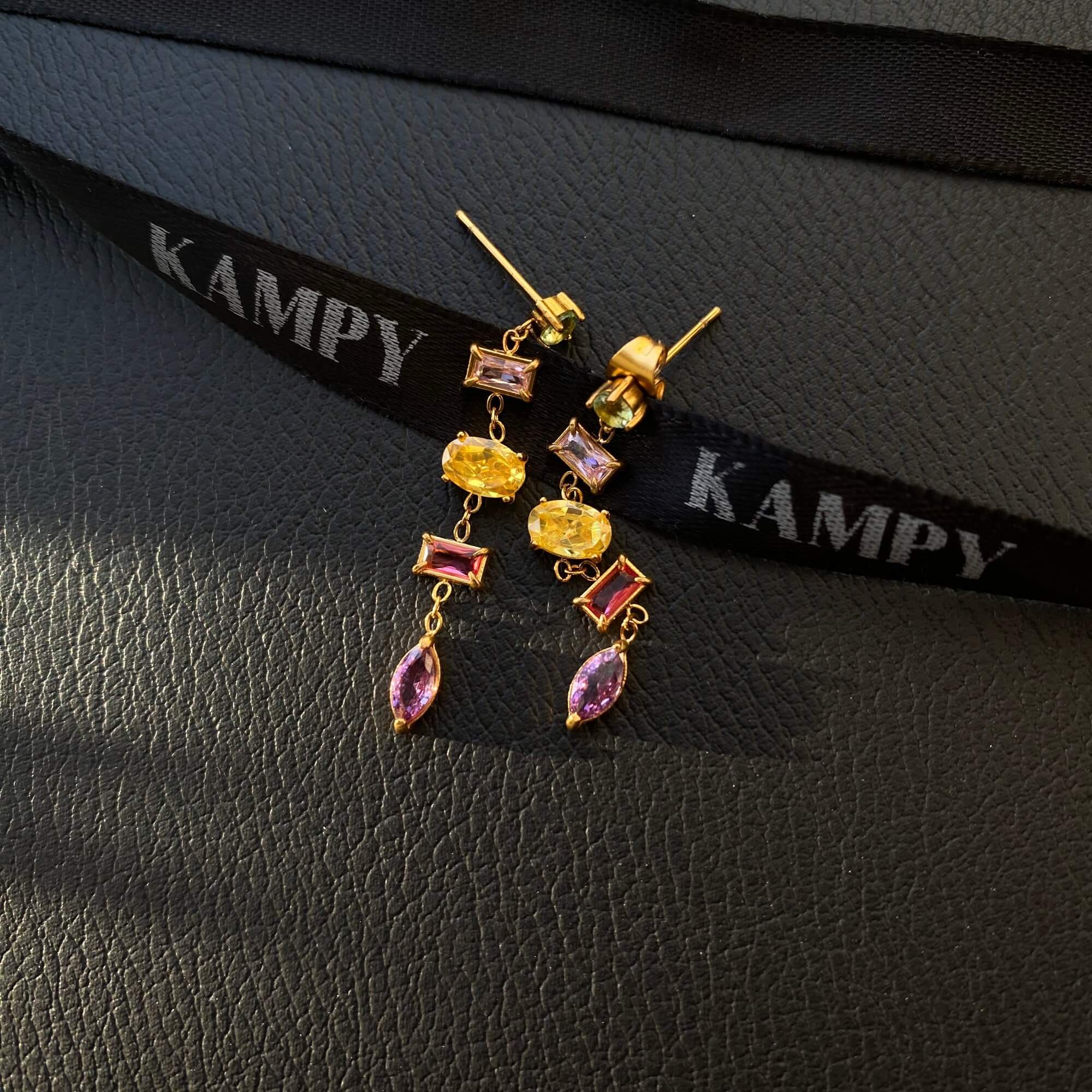 Angled front view of the KleoE CZ gemstone dangle earrings by Kampy Designs, emphasizing their elongated shape and dazzling stones.