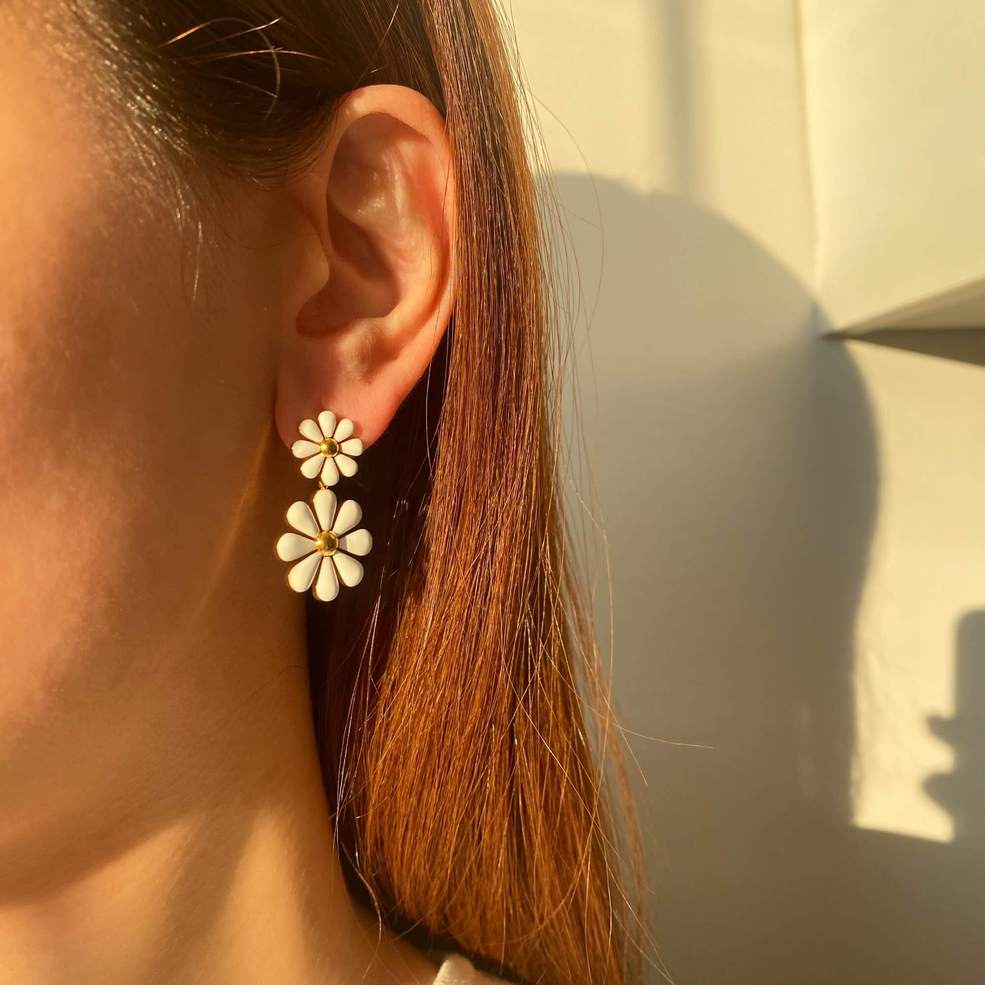 Styled editorial shot of KendyR daisy drop earrings by Kampy Designs, part of a curated spring jewelry look.