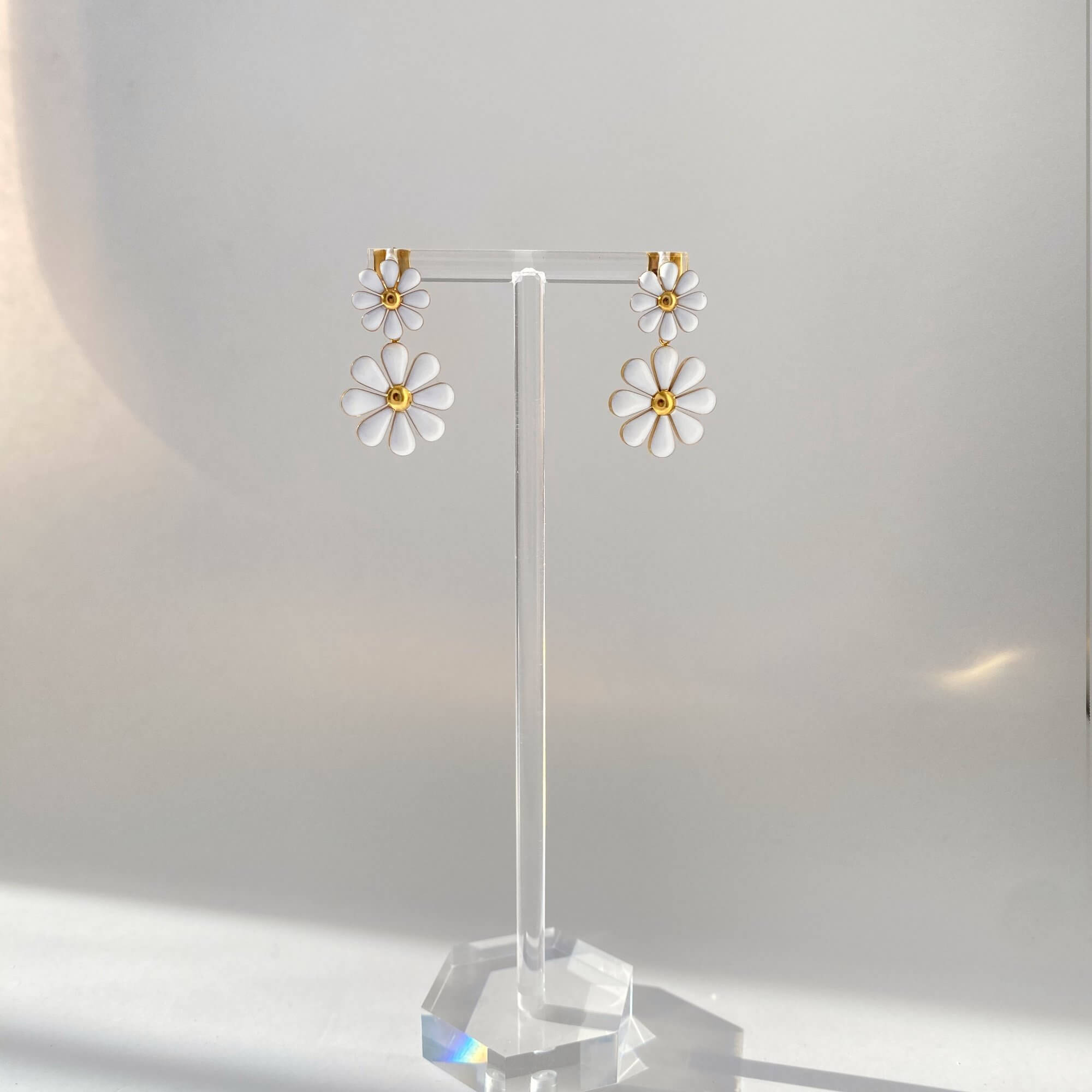 Front product view of the KendyR daisy drop earrings by Kampy Designs, emphasizing the symmetrical daisy form and elegant drop length.
