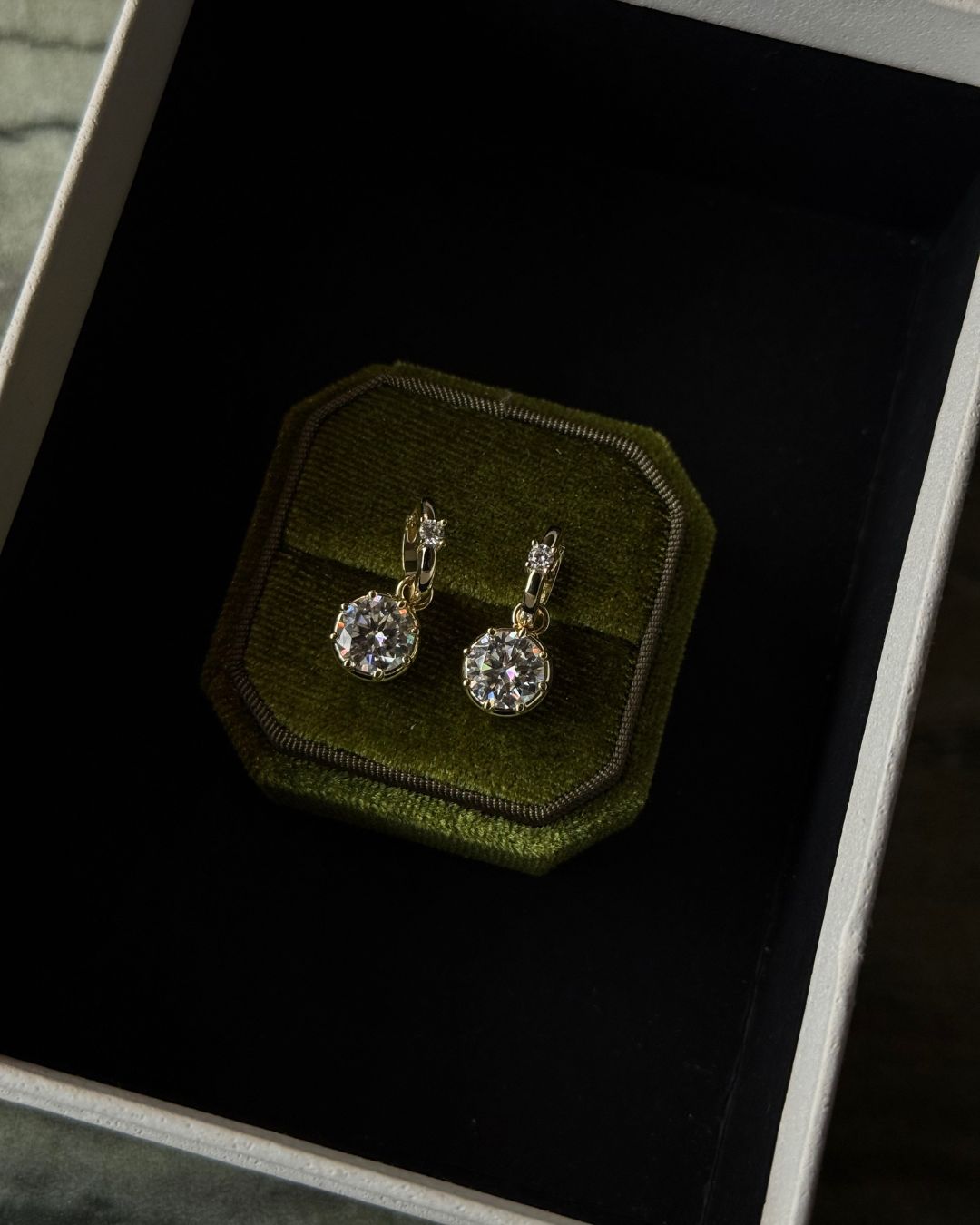 pair of statement diamond round stone earrings
