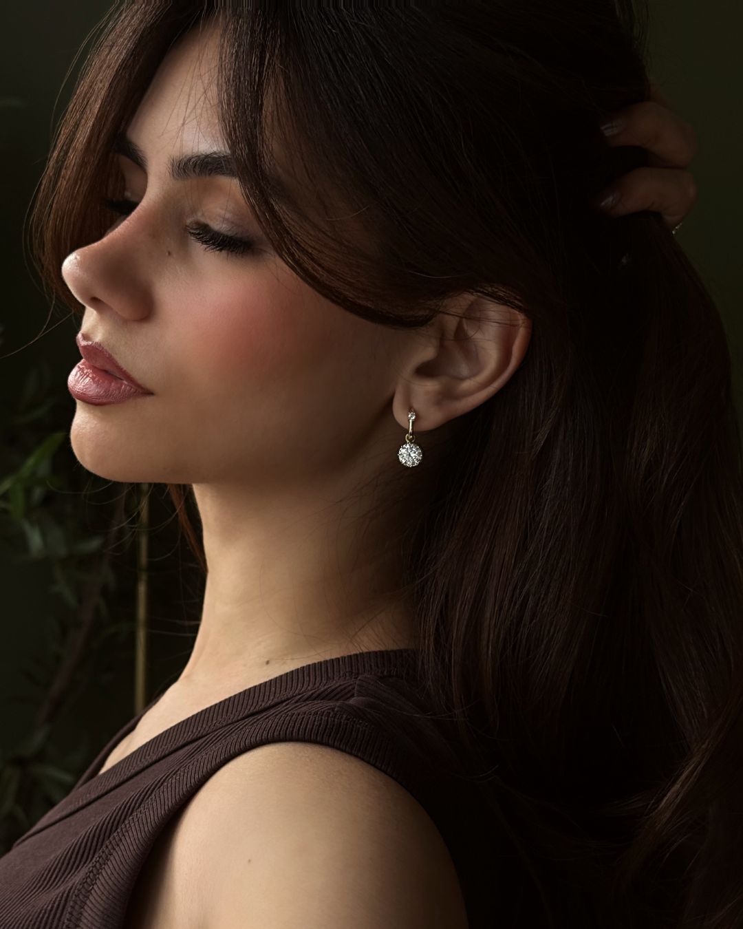 model wearing diamond drop earrings