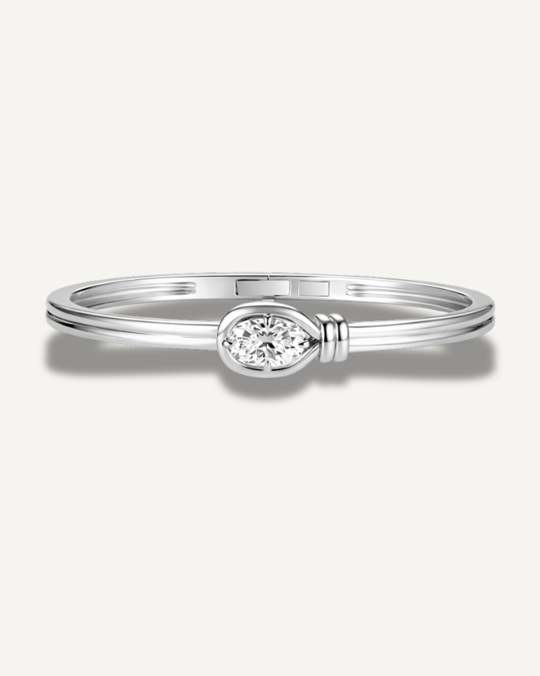 Elara white gold elongated cushion cut moissanite knot bangle in 925 sterling silver with bezel set 2ct center stone and secure clasp closure.