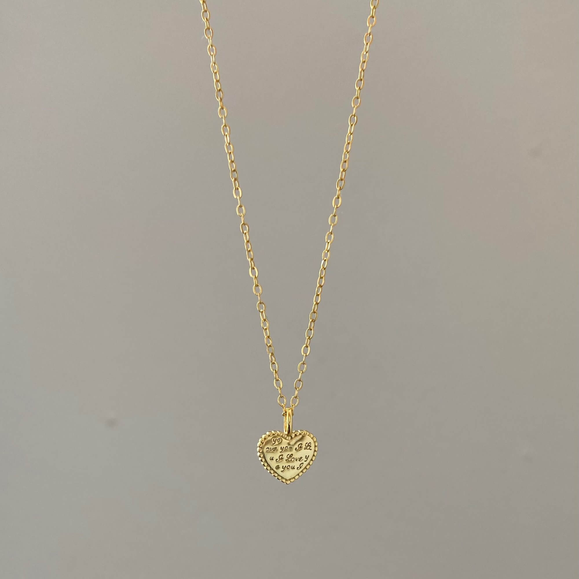 Front view of the KatreenN engraved heart necklace by Kampy Designs, featuring a beautifully detailed heart pendant on a fine gold chain.