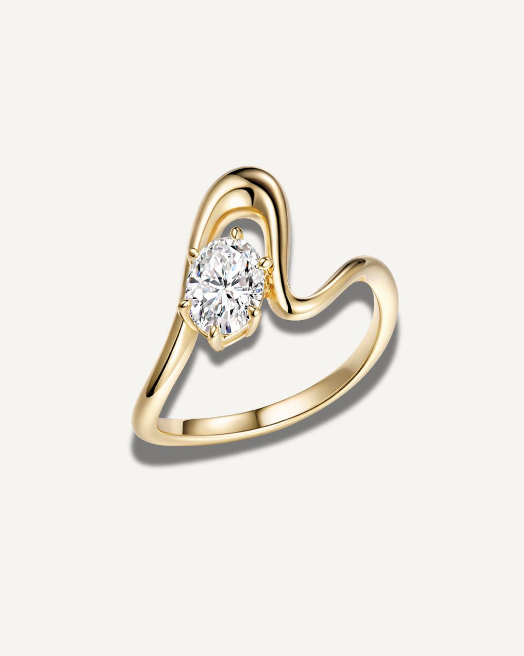 Gold wave band pinky ring with oval moissanite center stone in a clean front view on a neutral background