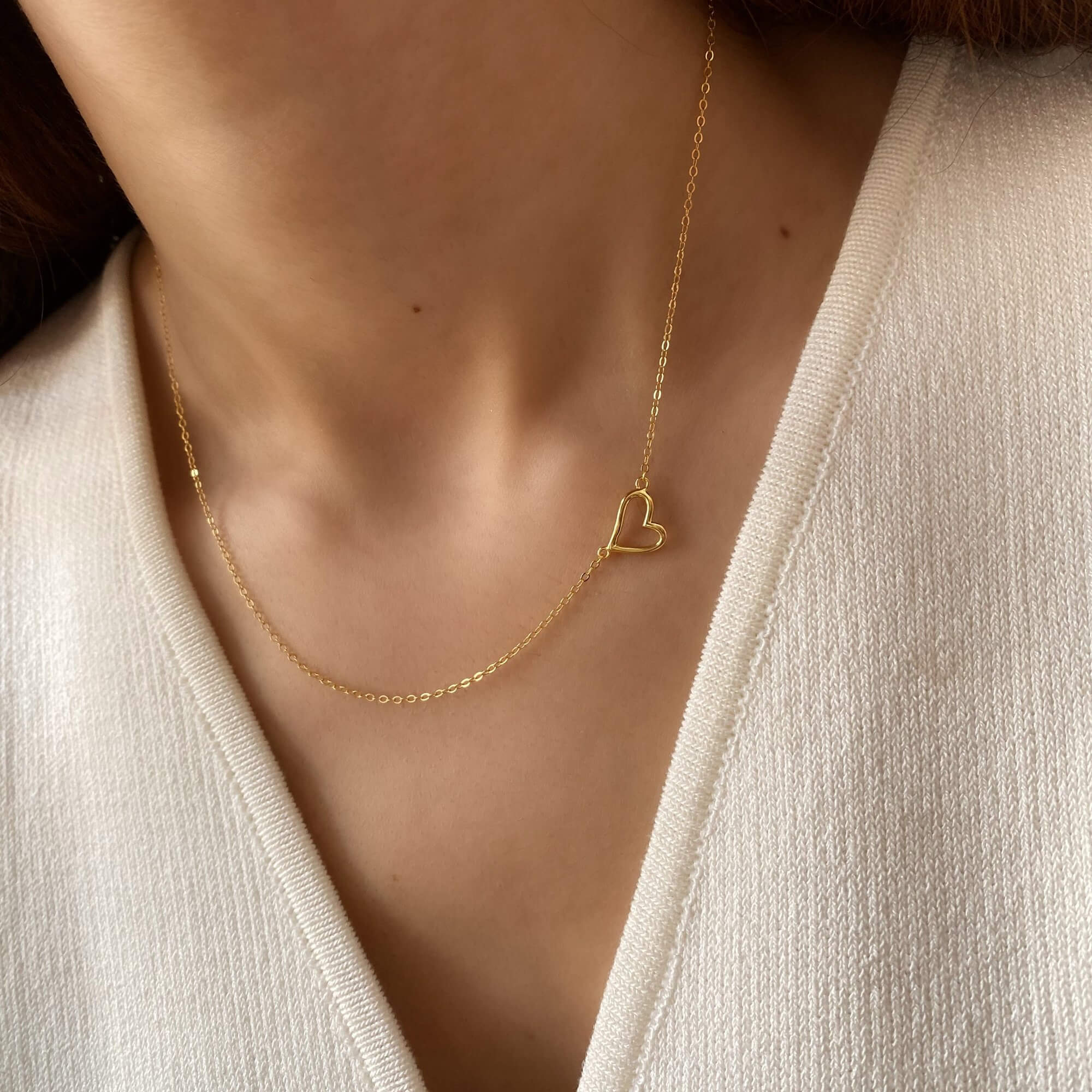 Alternative worn view of the KieraN hollow heart charm pendant necklace by Kampy Designs, capturing its subtle shine and timeless heart design.