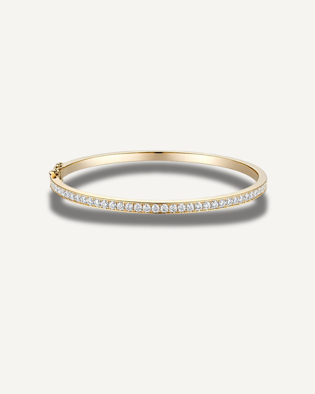 Lara 2mm moissanite tennis eternity bangle in 14K gold over 925 sterling silver featuring a slim 3mm pavé design and secure clasp closure.