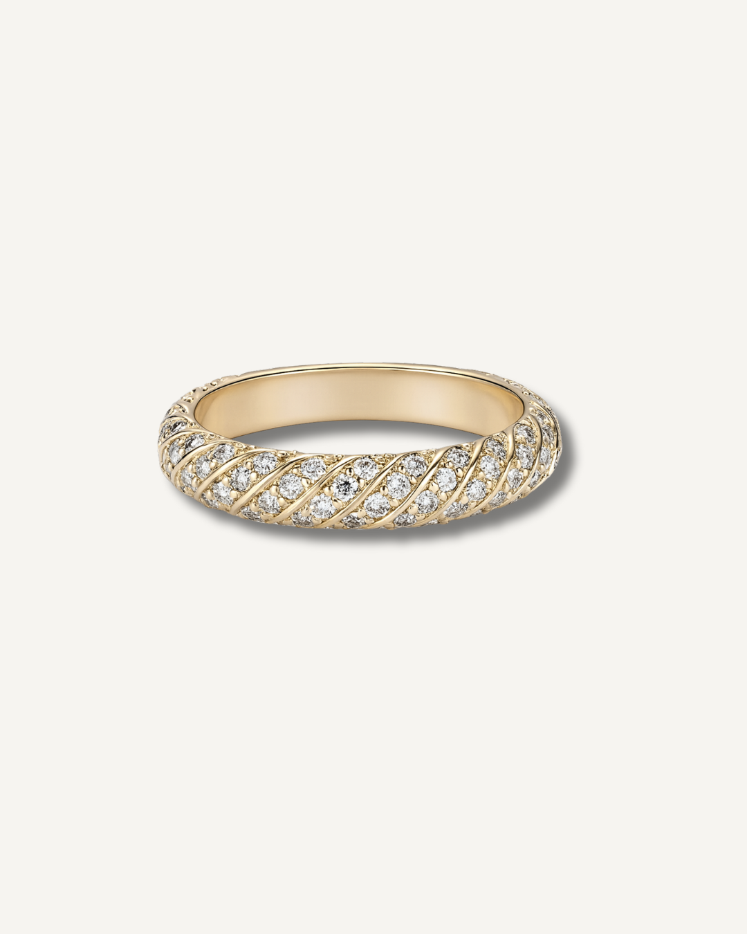Moissanite twist pavé wedding band in gold finish on neutral background, Kampy Designs