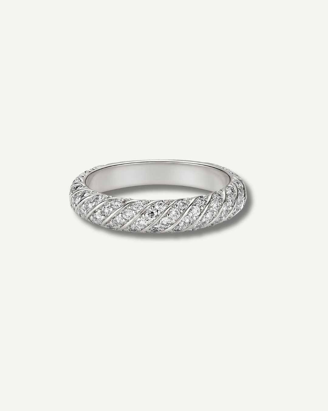Moissanite twist pavé wedding band in silver finish on neutral background, Kampy Designs