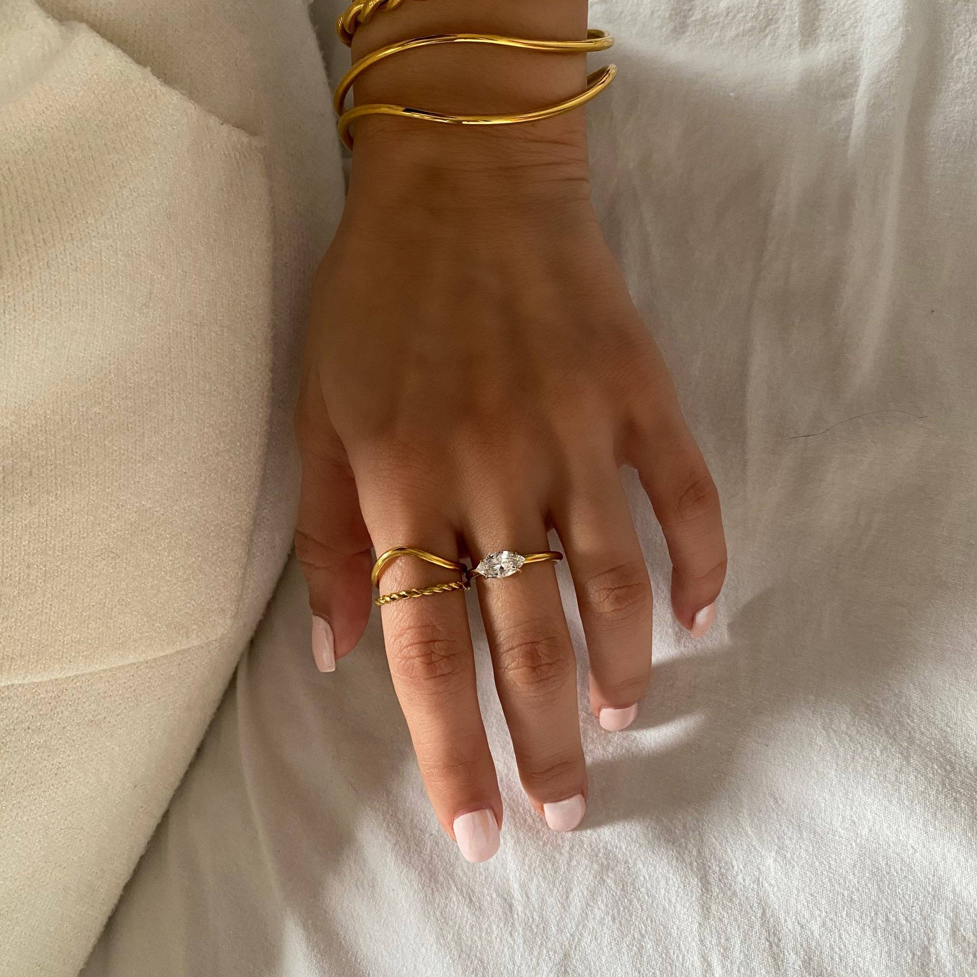 Styled display of Kair marquise ring set by Kampy Designs, arranged for a clean editorial presentation with modern flair.