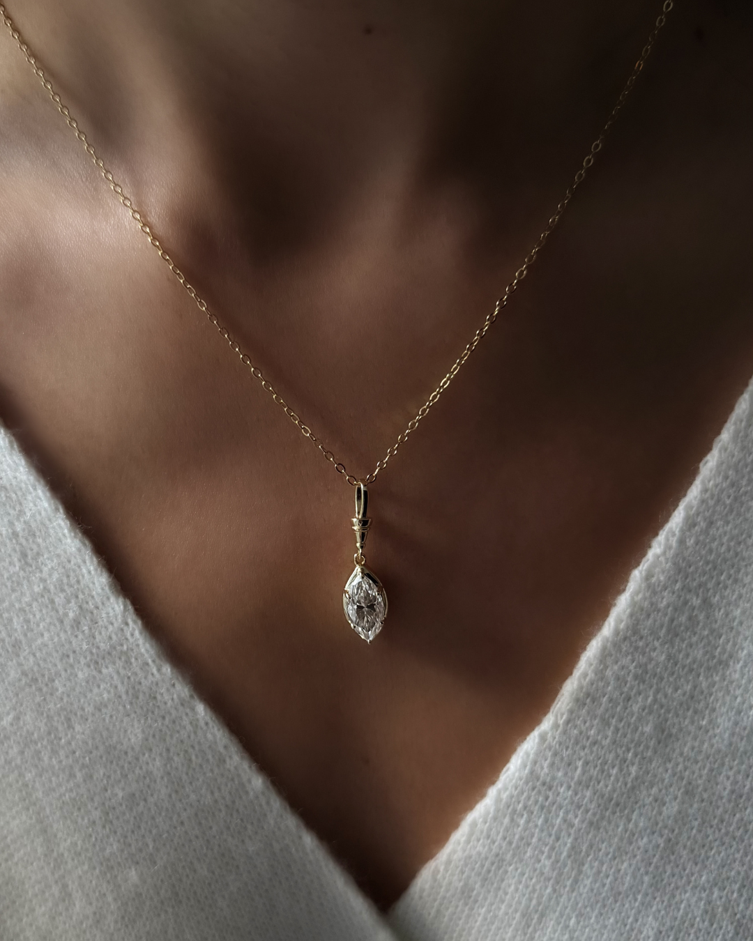 White moissanite marquise necklace worn on model highlighting elongated neckline and collarbone by Kampy