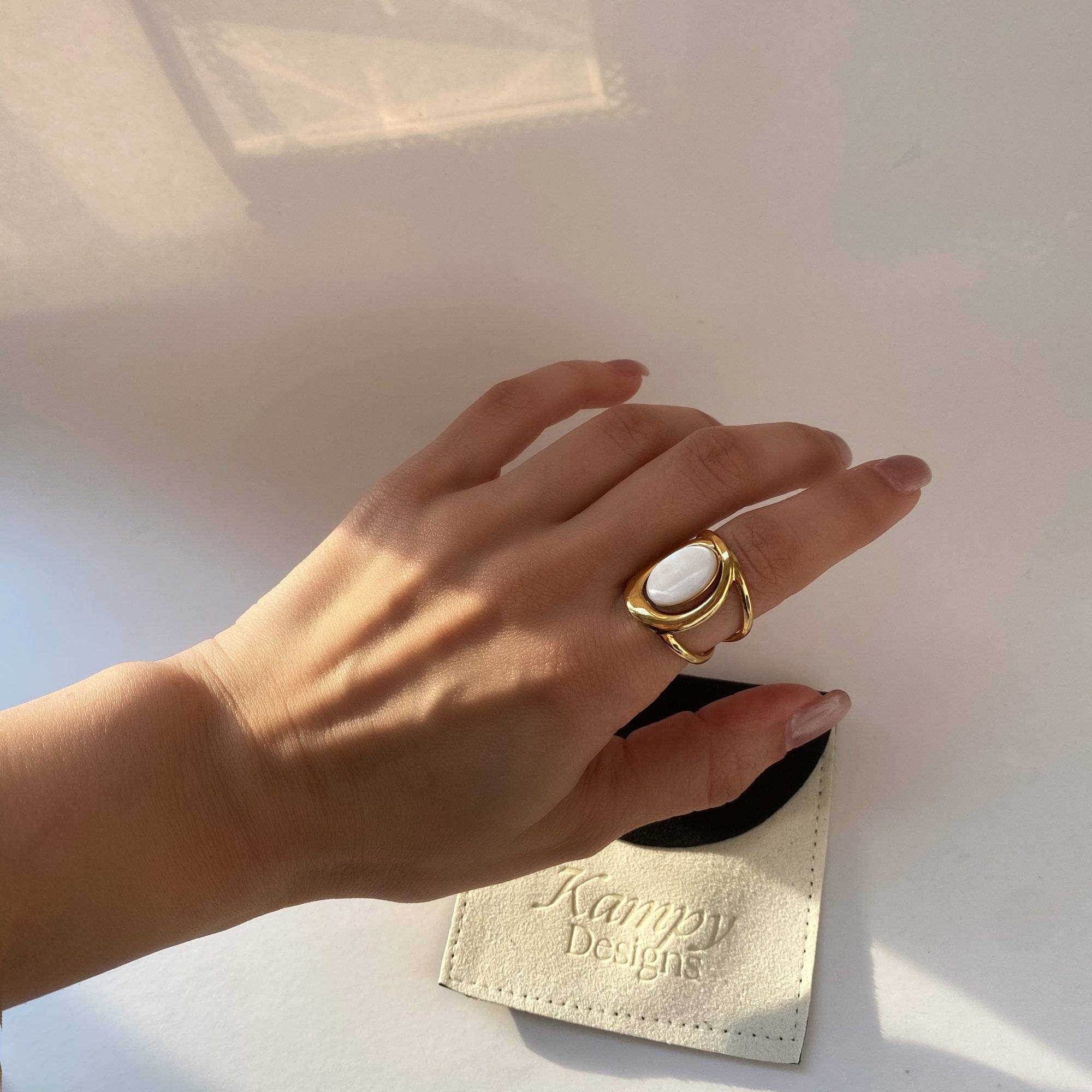 Styled look of Kostar opal split shank ring by Kampy Designs, worn by model for a minimal and modern jewelry vibe.
