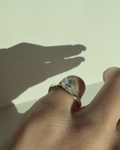 Video of east-west pear cut moissanite wave ring worn on pinky finger, Kampy Designs
