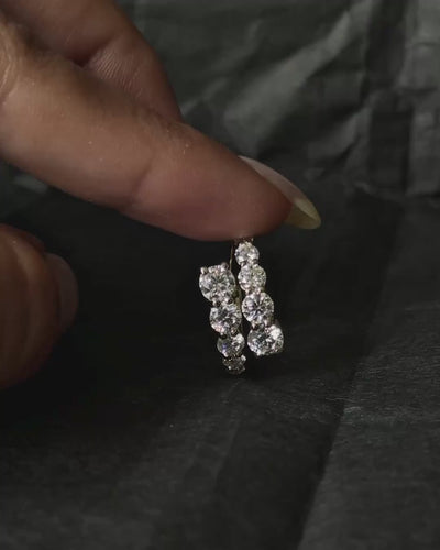 model putting on sparkly wrap ring on finger