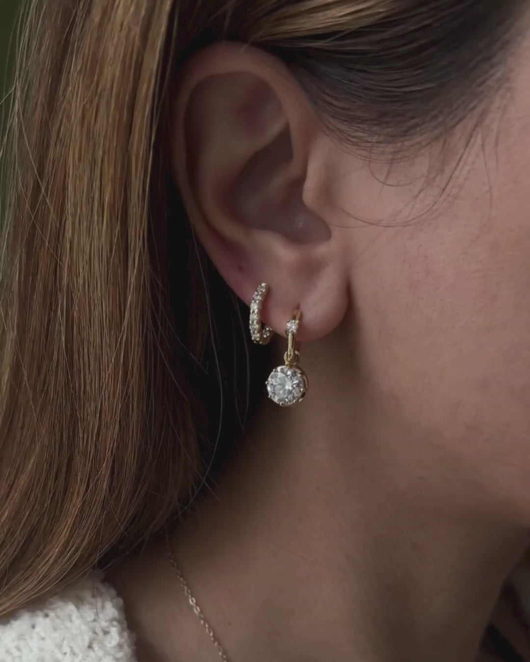 Kampy Designs Lumina Drop Earrings video showing 2ct moissanite drop earrings worn on ear with natural movement.