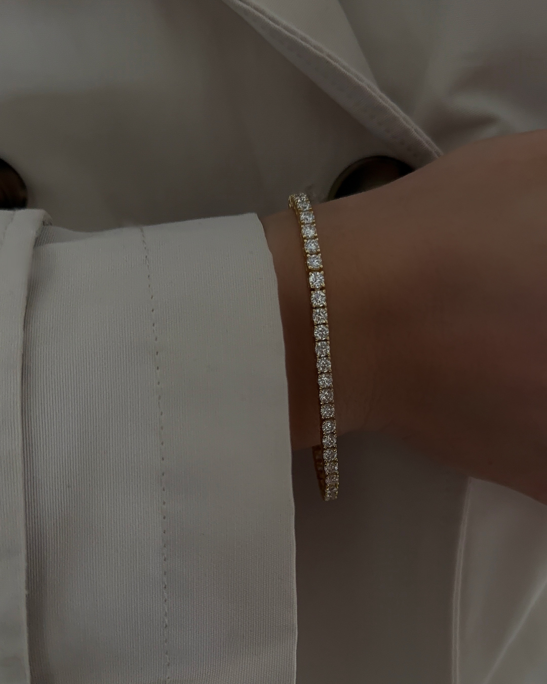 Model wearing sterling silver lab-grown moissanite tennis bracelet with 3mm stones — Kampy
