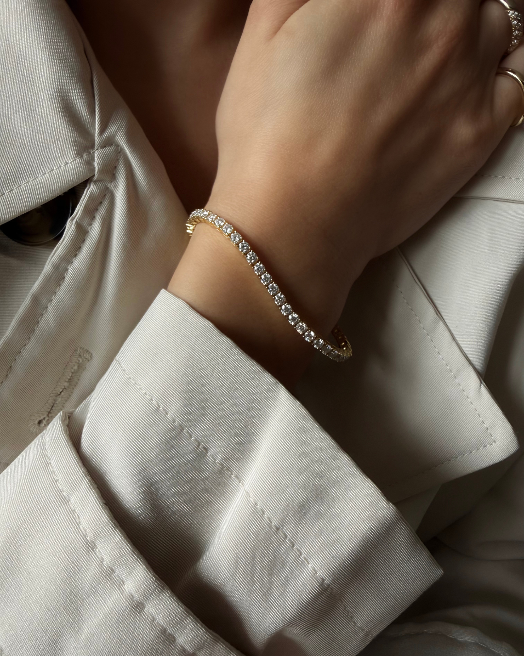 Top view of sterling silver lab-grown moissanite tennis bracelet showing continuous 3mm round stones — Kampy