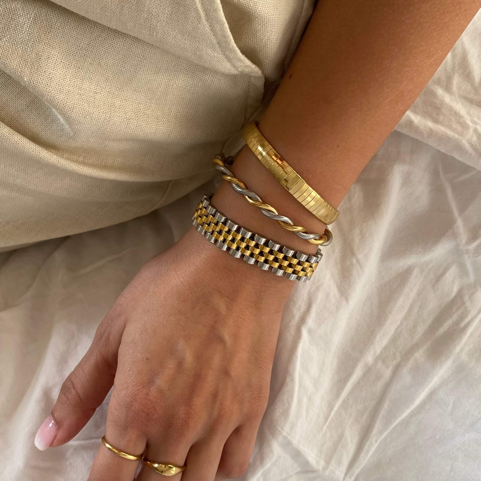 Angled view of the KeranB two-toned thick watch bracelet (16.5cm-18cm) by Kampy Designs, capturing the elegant contrast of its dual-metal design.