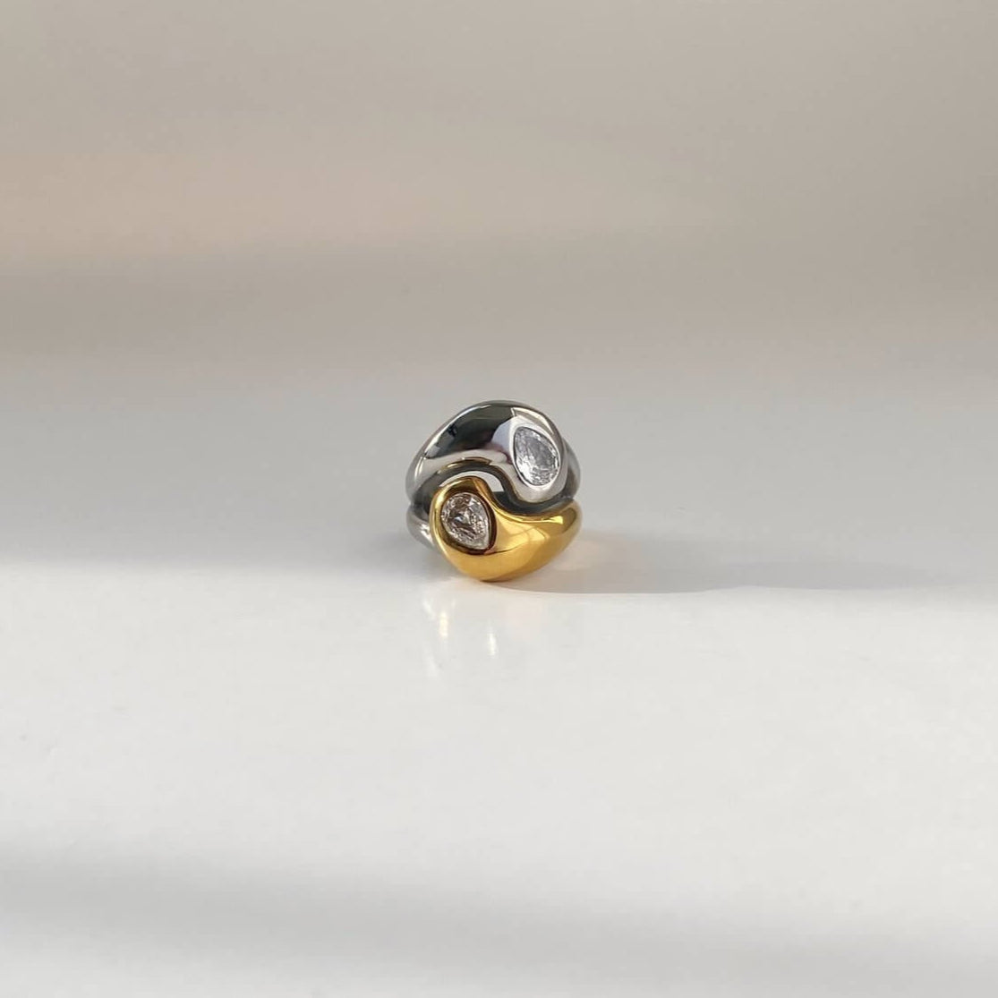 Flat lay of the KangR two-toned yin yang ring by Kampy Designs, elegantly displayed to reflect its contemporary design and spiritual symbolism.