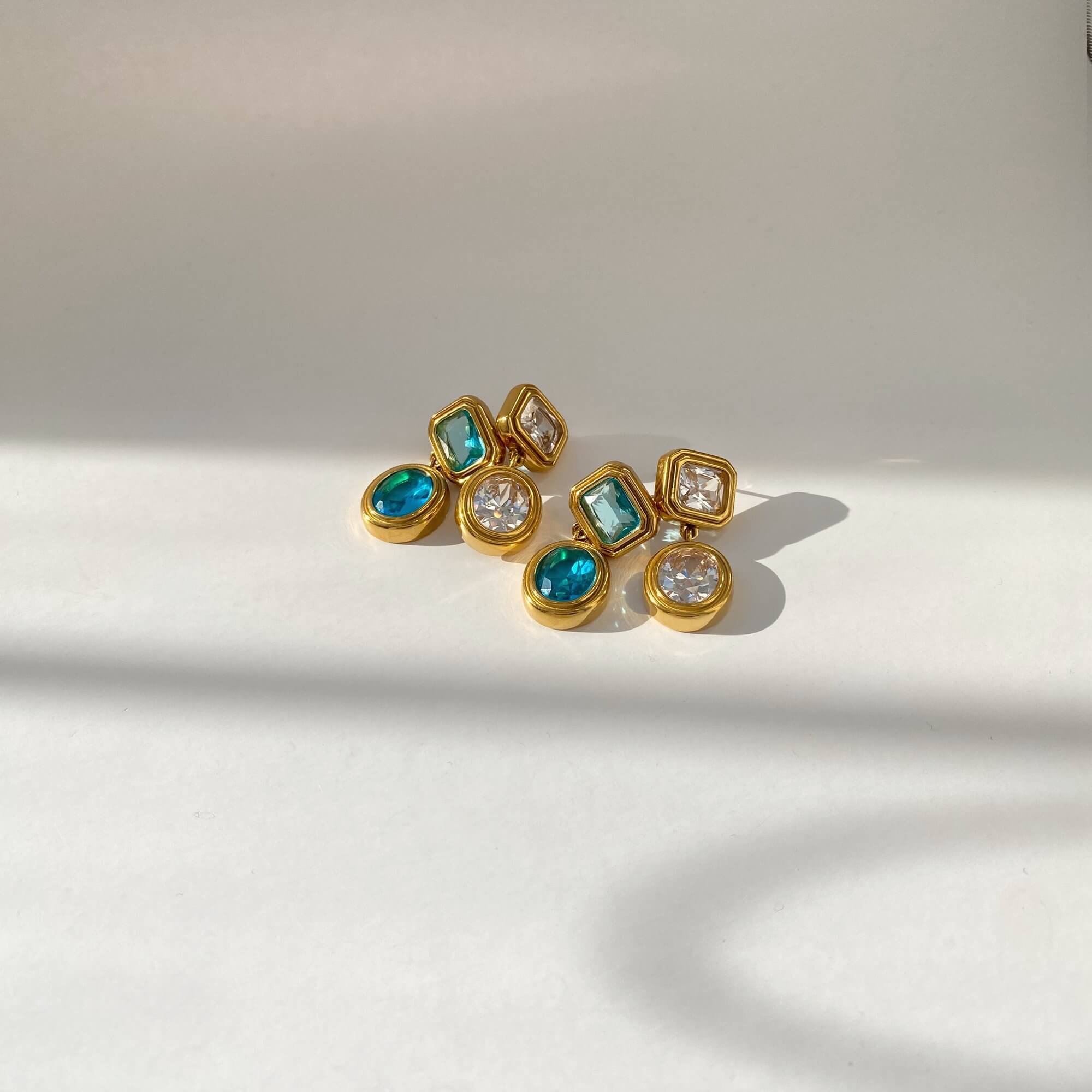 Clear version of KosaE vintage-inspired dangle earrings by Kampy Designs, worn on model for a classic and elegant crystal look.
