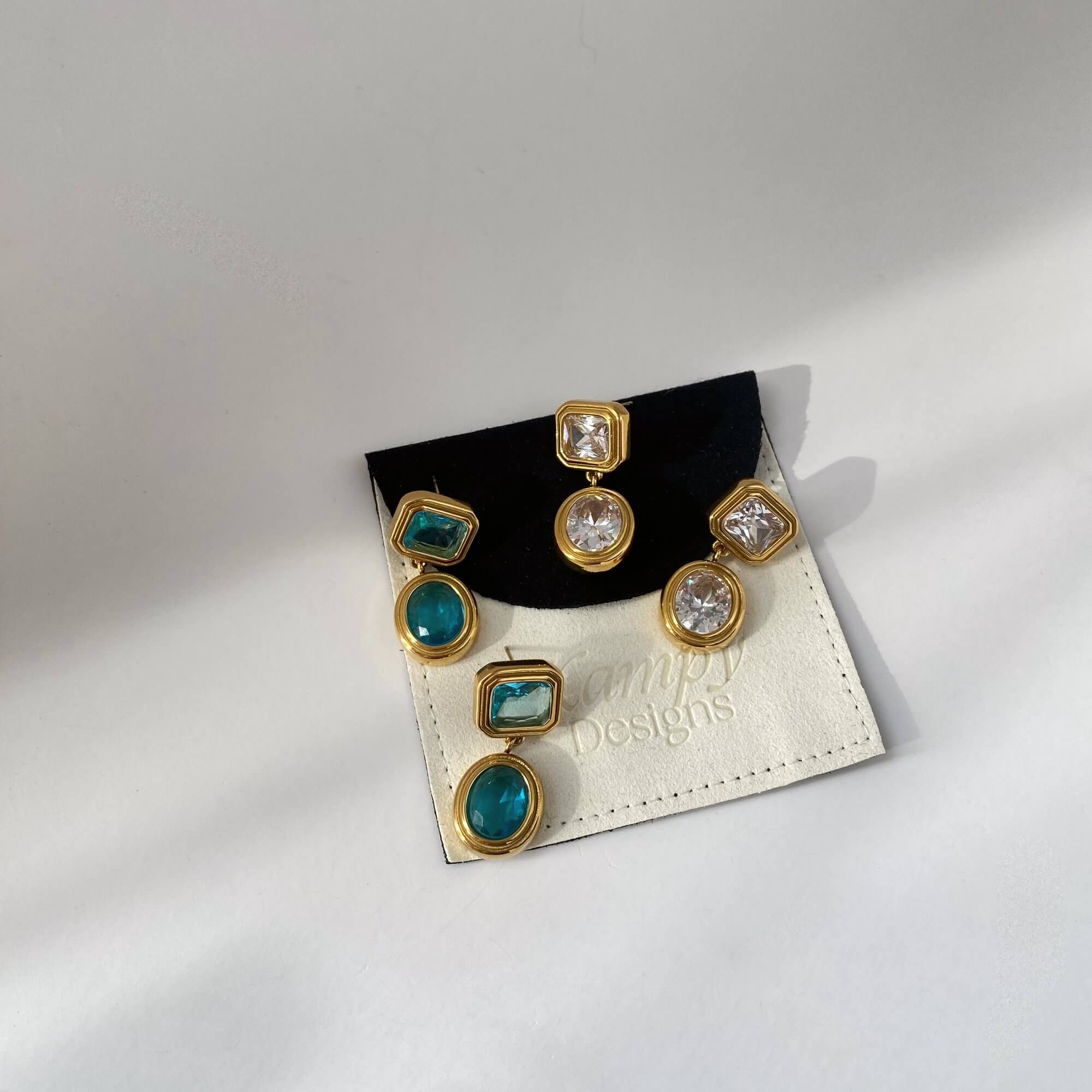 KosaE vintage-inspired dangle earrings by Kampy Designs, worn on model's ear to showcase their classic silhouette and drop design.